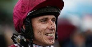Which horse was Paddy Brennan's first Grade 1 winner?  